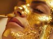 Esthetician performing a 24K gold facial treatment at Karmina Beauty Clinic in Forest Hills Queens NYC