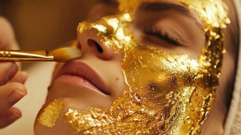 Esthetician performing a 24K gold facial treatment at Karmina Beauty Clinic in Forest Hills Queens NYC